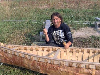 Mike Gauthier finishes the canoe he and his friends built last summer 